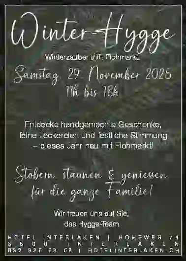 Event flyer with a dark green leafy background. White handwritten and serif fonts announce Winter-Hygge market on 29 November 2025, 11–18h, with handmade gifts, treats, and family fun at Hotel Interlaken, Switzerland.